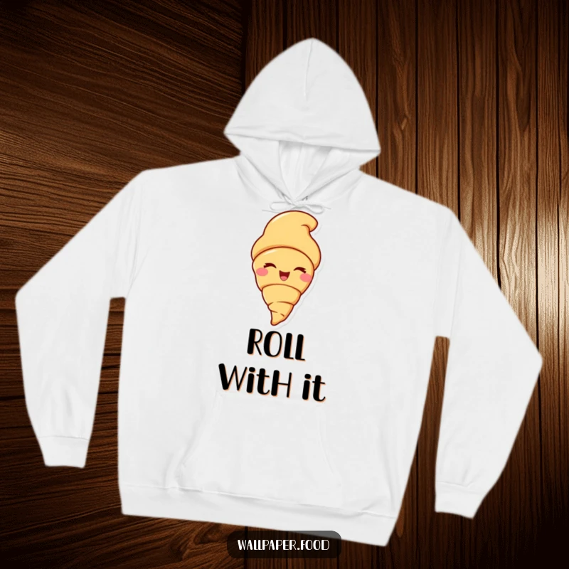 Funny hoodie featuring a delighted croissant character winking flirtatiously, offering a warm and humorous embrace.